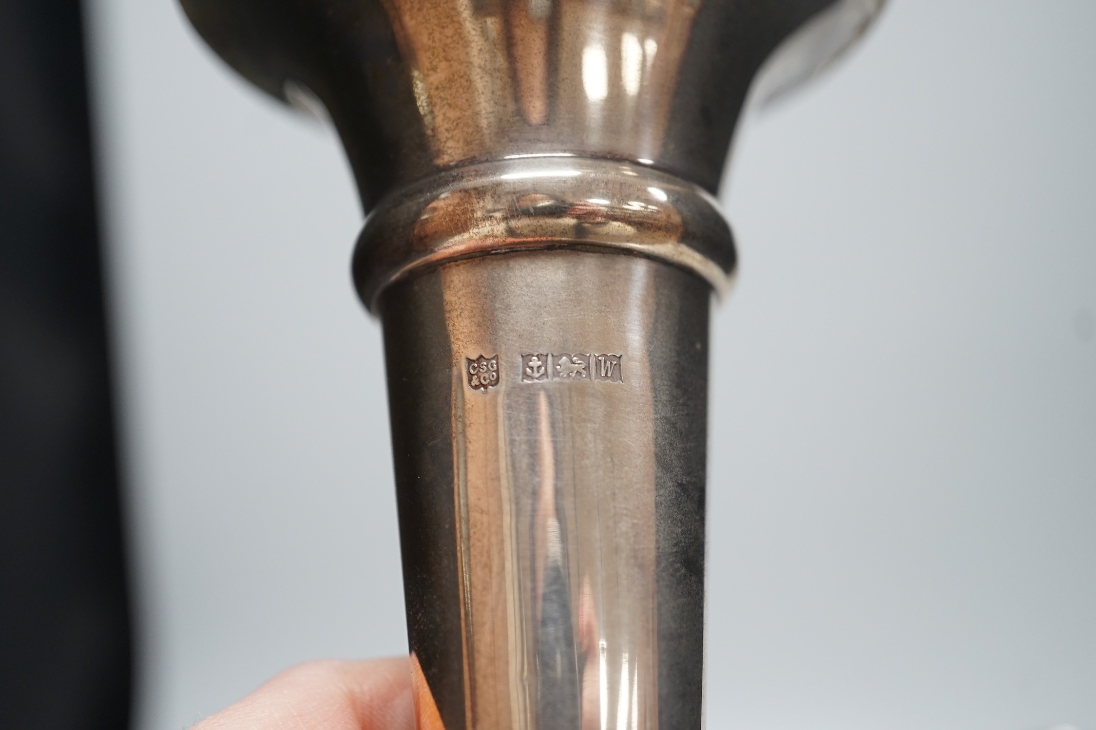 A pair of modern silver mounted candlesticks, 15.4cm, weighted, three other silver mounted dwarf candlesticks and a silver mounted spill vase.